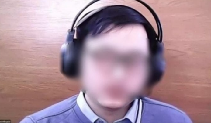 北朝鮮のIT工作員と疑われる人物が面接を受ける映像。映像では、この面接者が「金正恩を罵ってみろ」という質問者の要求に答えられず、通話を切った。記事は写真と直接関係ない。 [Xキャプチャ]