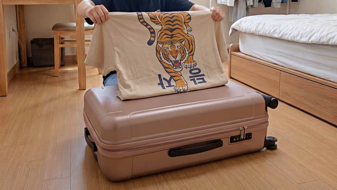 Stop Buying Suitcase Covers: Use This 1-Minute T-Shirt Hack Instead