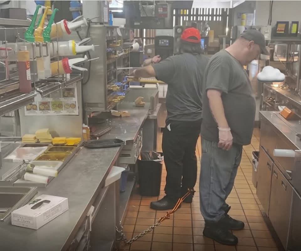 Chained to the Job? Viral Photo of Fast Food Worker Sparks Outrage